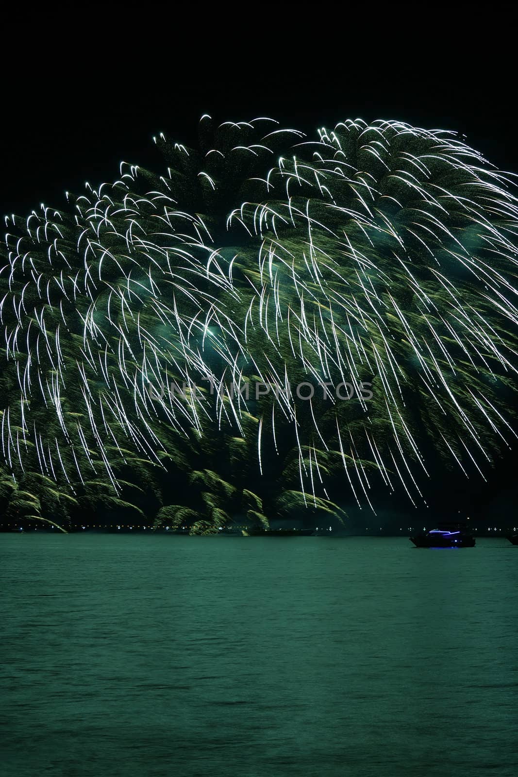 colorful huge fireworks display and reflection.