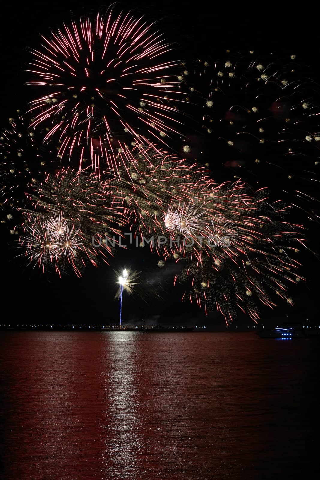 colorful huge fireworks display and reflection.