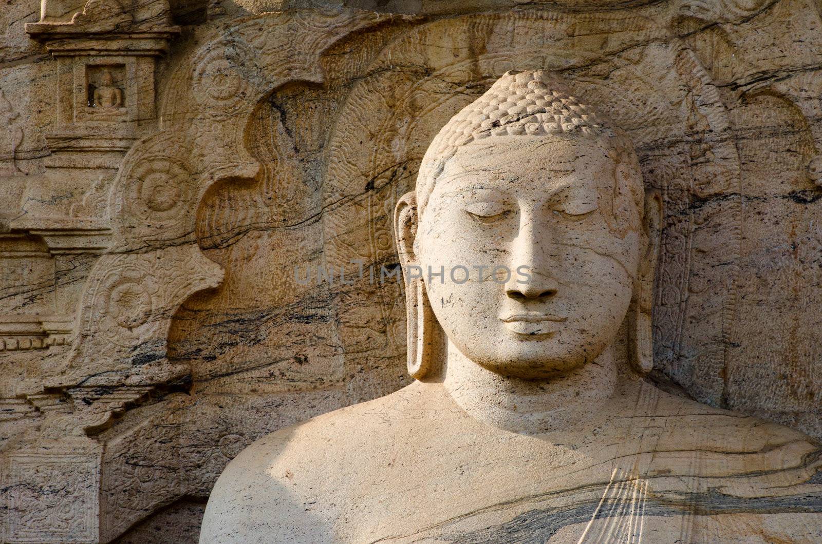 Buddha face with ornamental stone background, Polonnaruwa, Sri Lanka