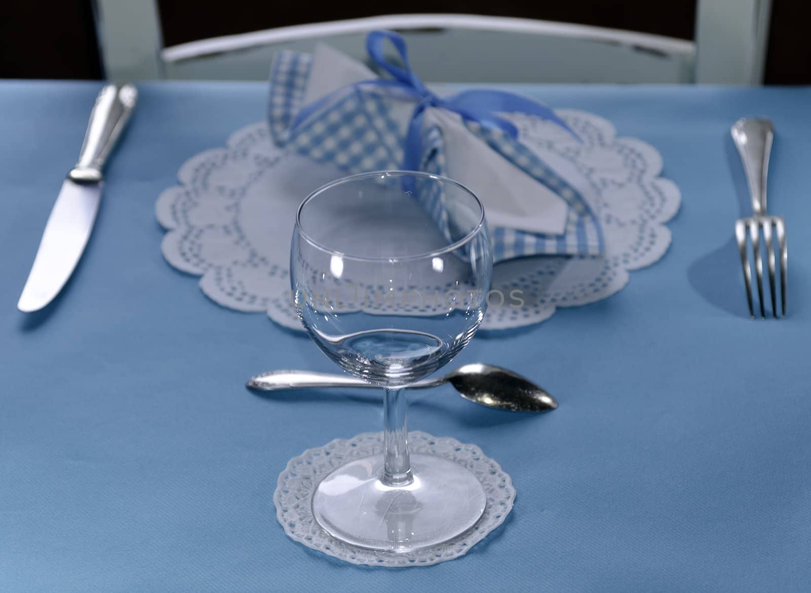 Table setting with fork, knife, glass and napkin