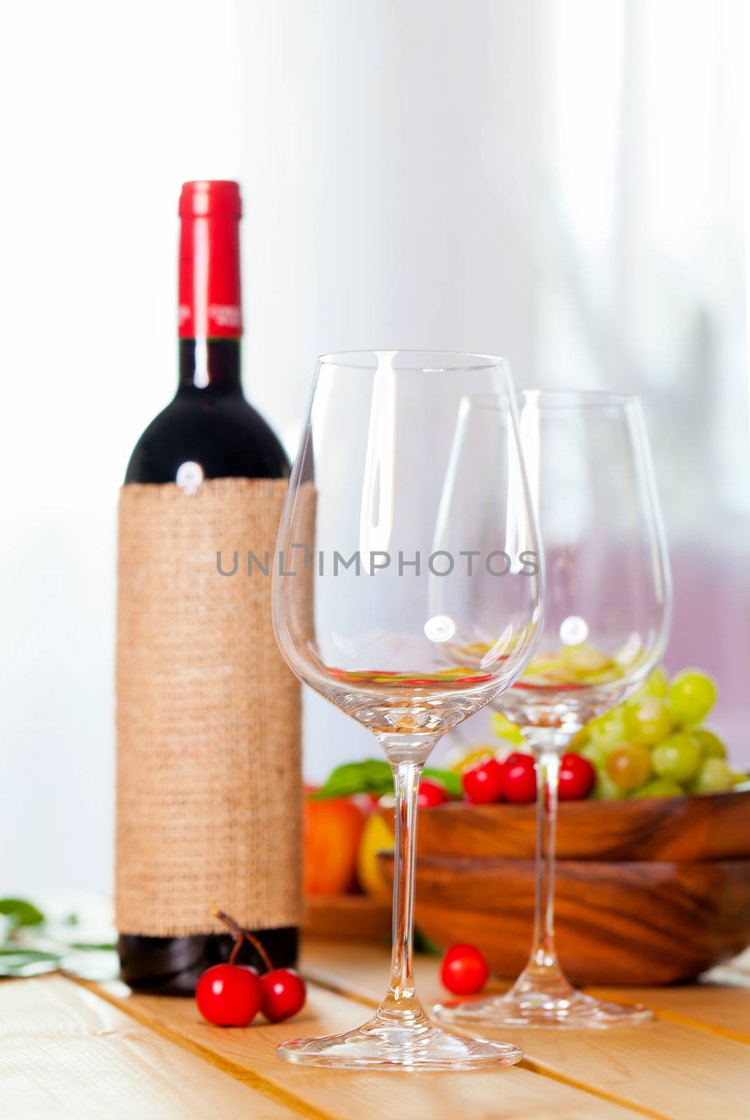 two glass with red wine on wooden table