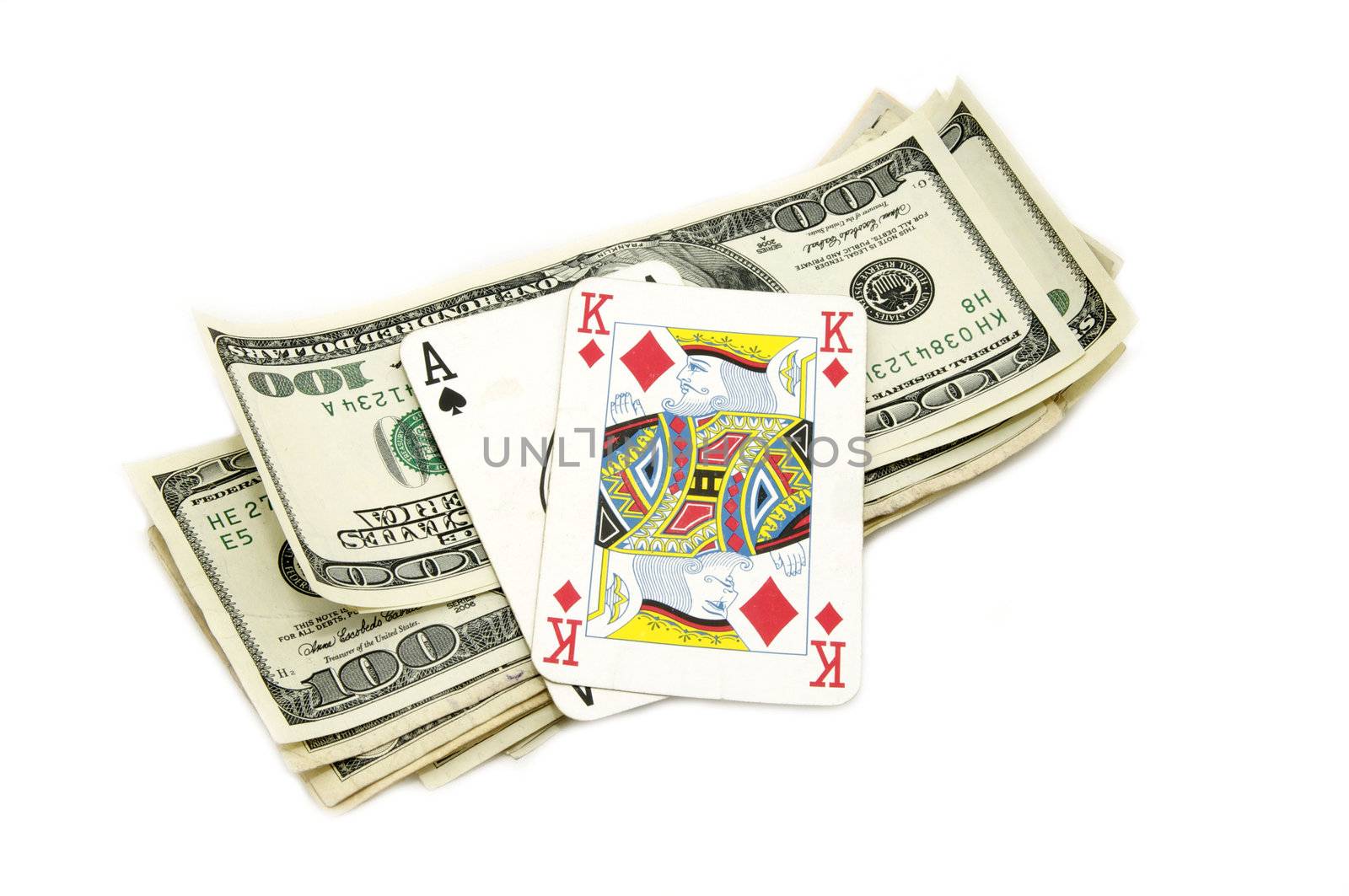 Dollars and playing cards on white background