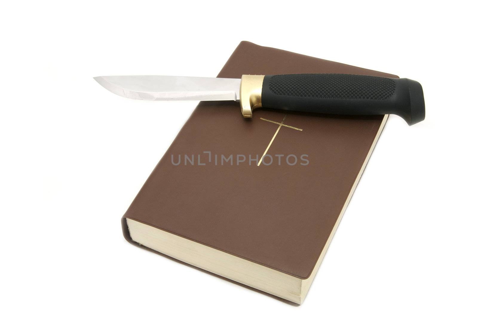Bible and a knife on a white background
