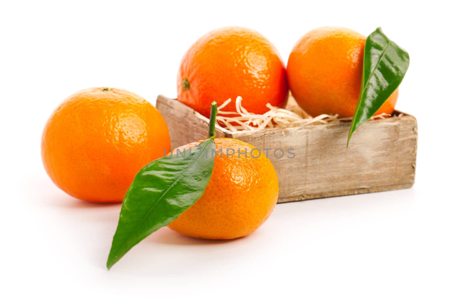 orange mandarins with green leaf isolated on white background