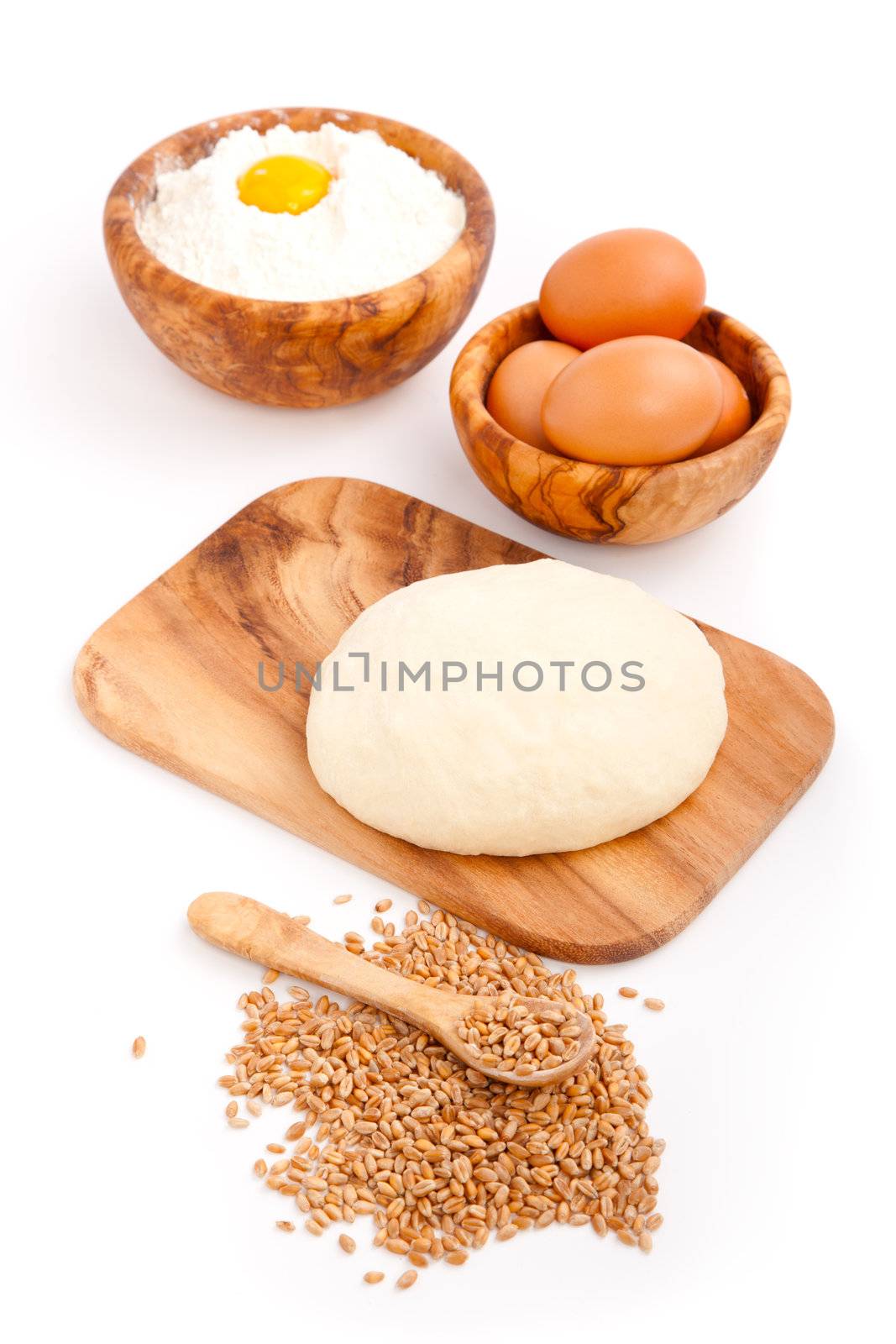 Raw freshyeast dough with eggs,  isolated on white by motorolka