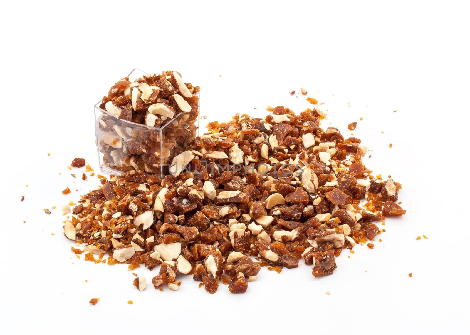 Caramelized crumbled Almonds for topping on white background