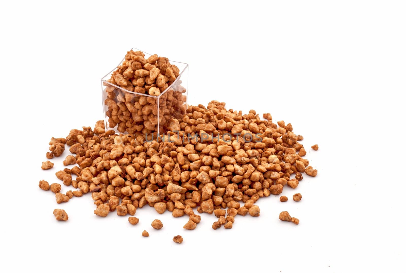 Caramelized sugary peanuts on white background