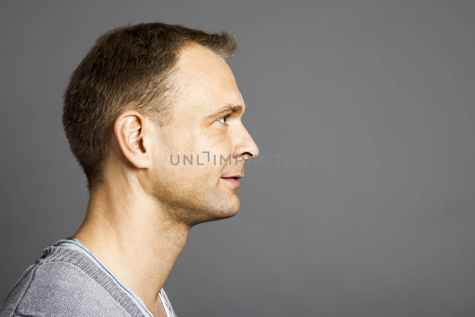An image of a nice male portrait side view