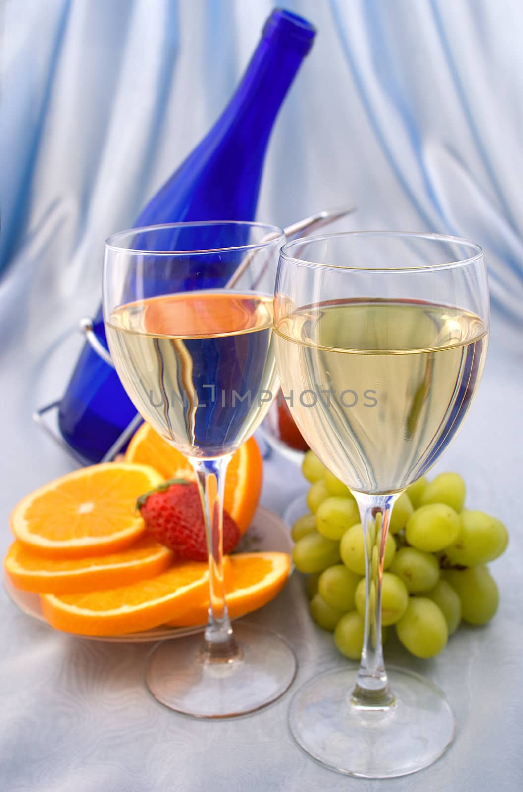 Two glasses of wine with oranges and grapes by BIG_TAU