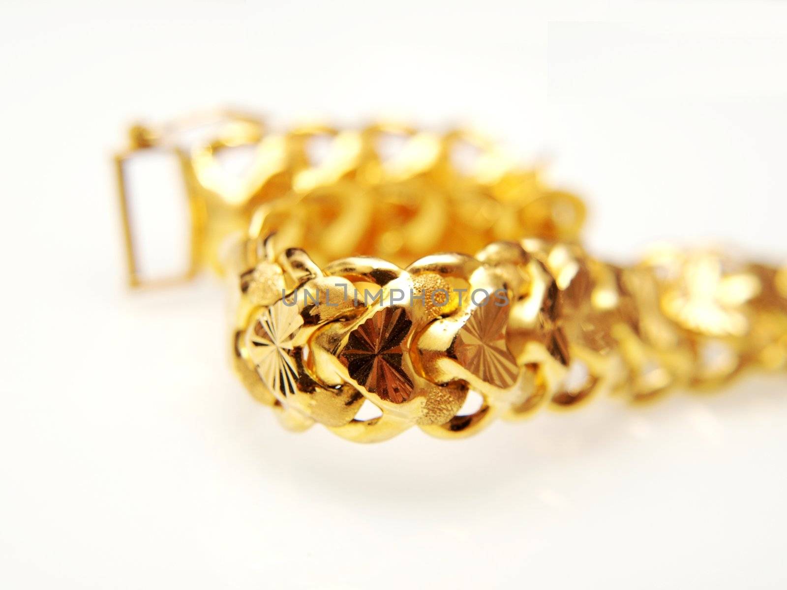 Yellow gold jewellry, isolated towards white background