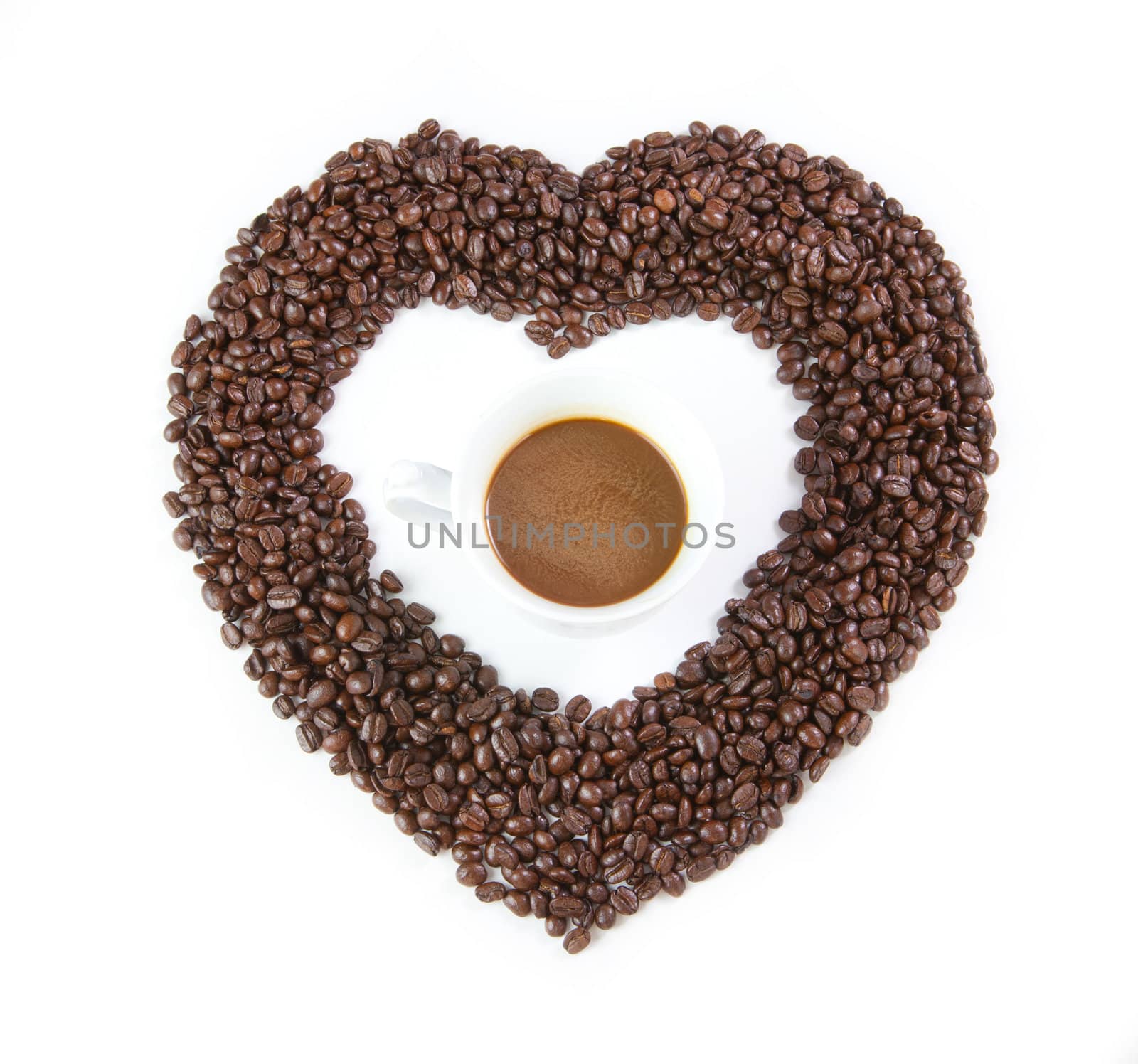 heart from coffee beans isolated on white