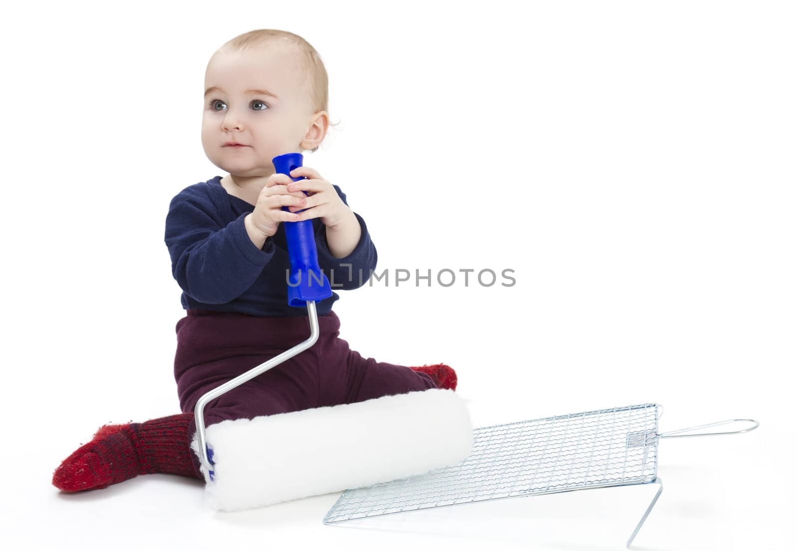 young child with painters equipment in light background