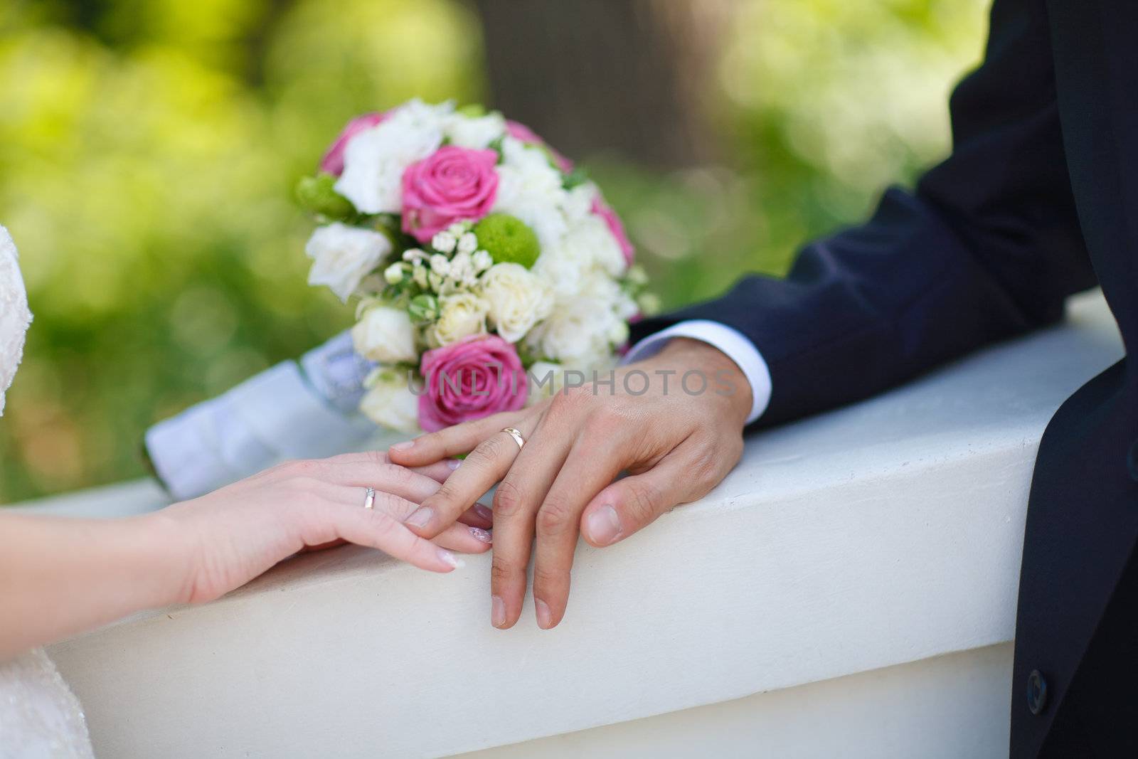 bouquet and wedding rings of bride and groom