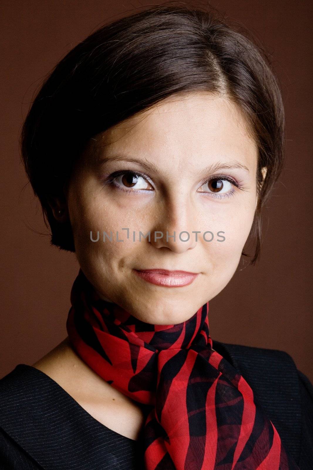 An image of a beautiful young woman in a scarf