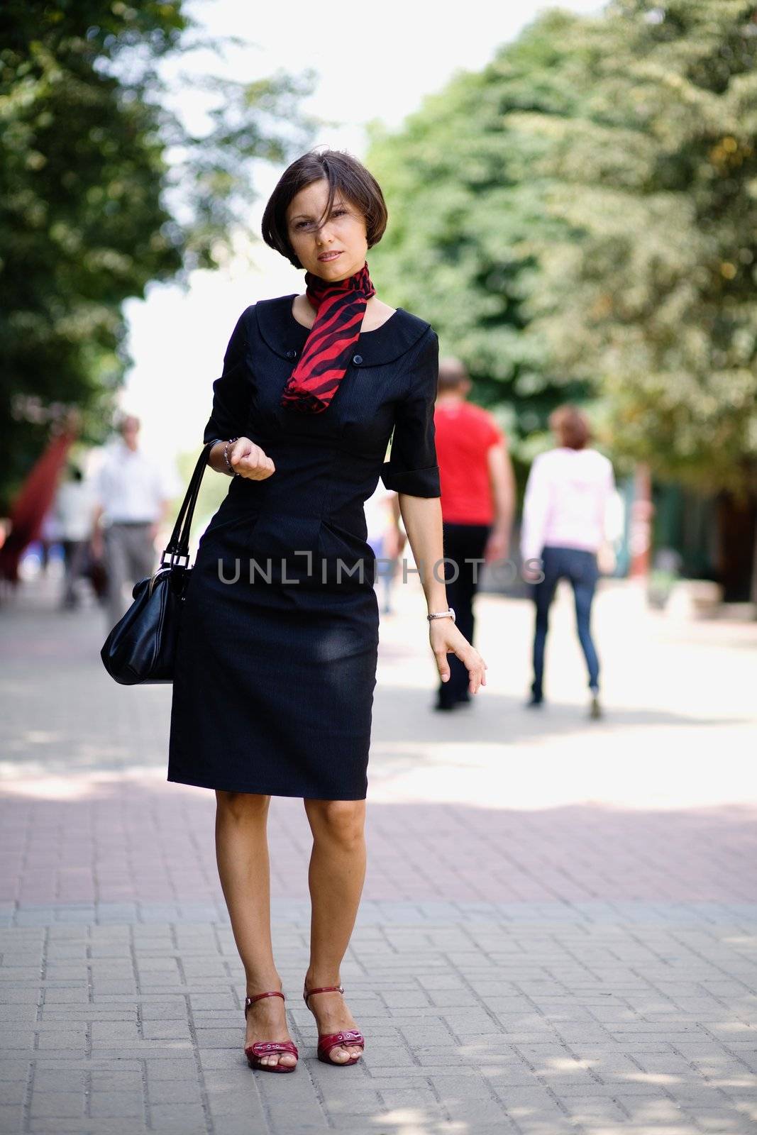 A beautiful woman walking in the street