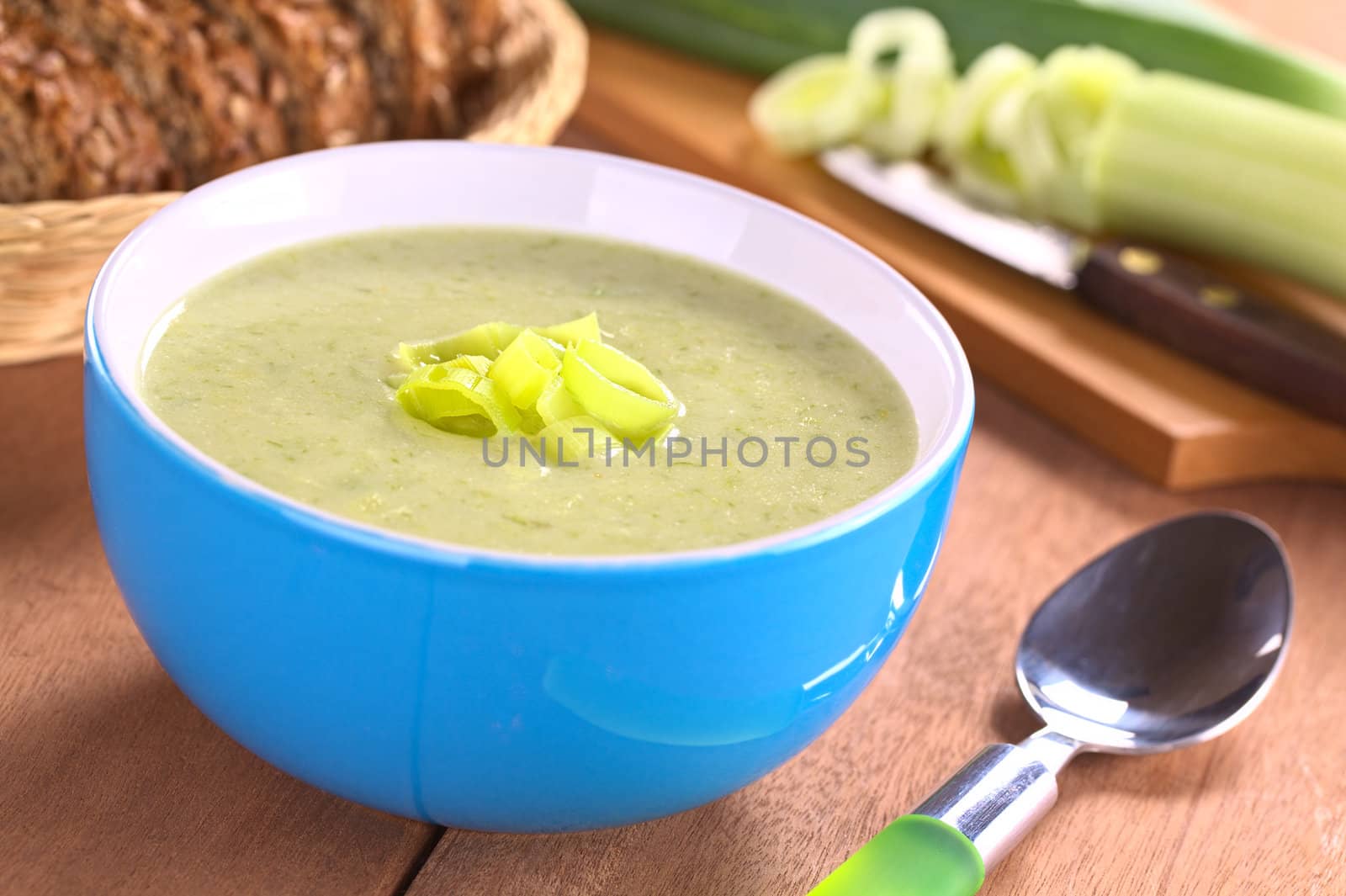 Fresh homemade leek soup (Selective Focus, Focus on the leek rings on the top of the soup)