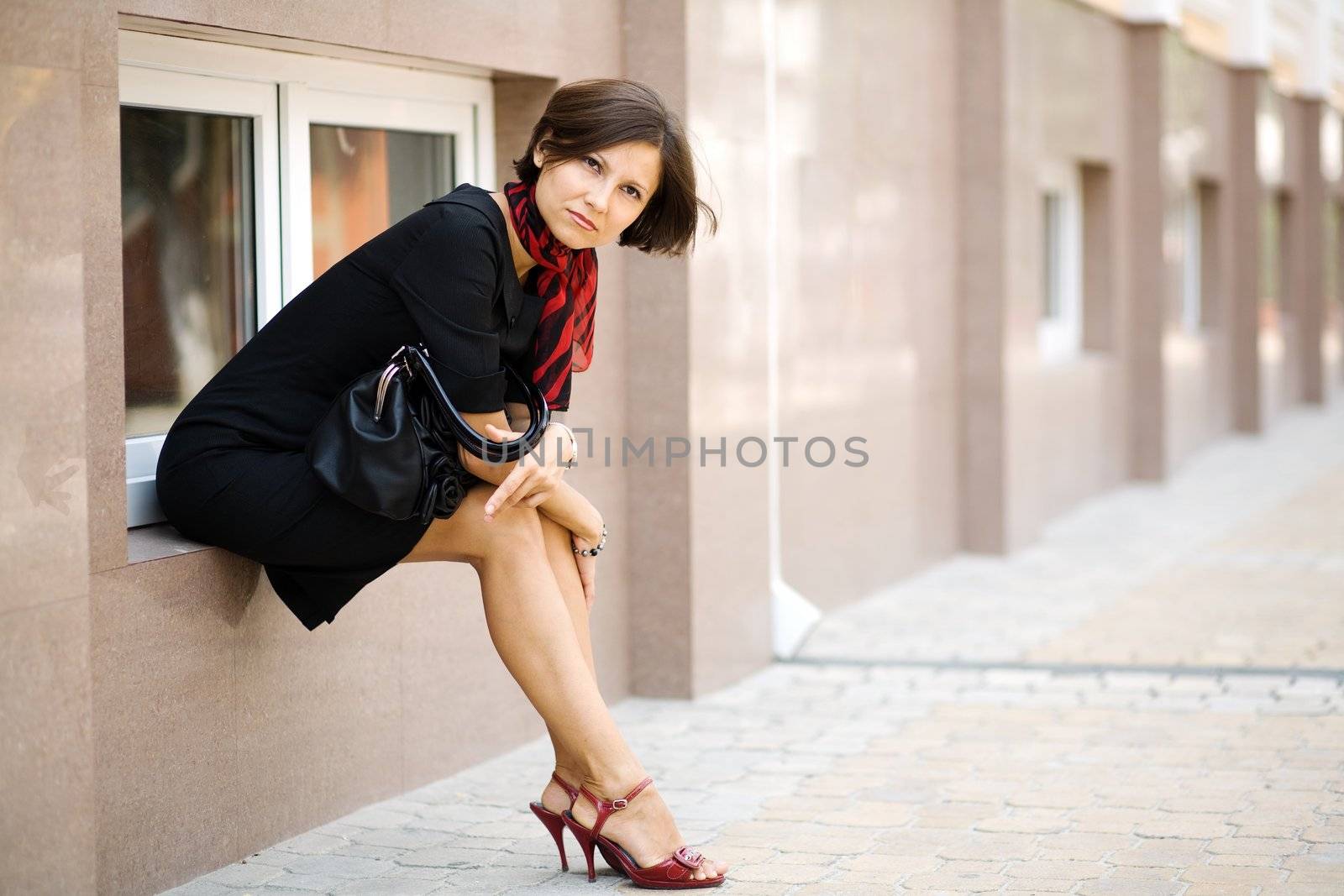 An image of a young woman in the street