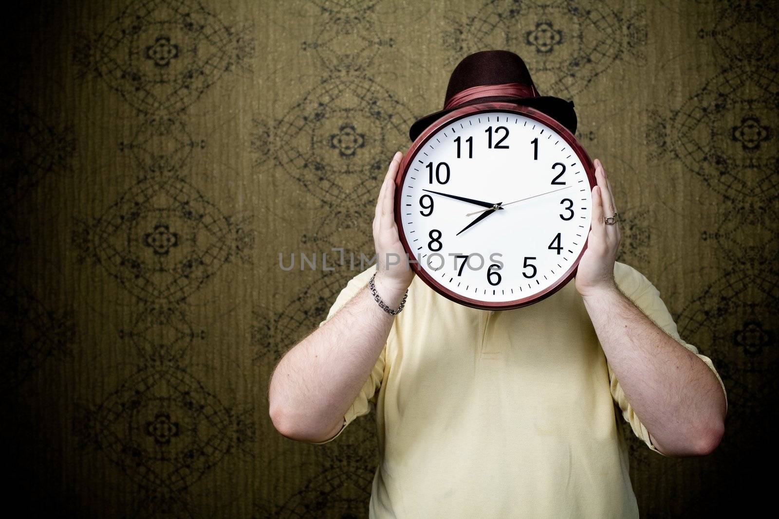 An image of a man with a big white clock