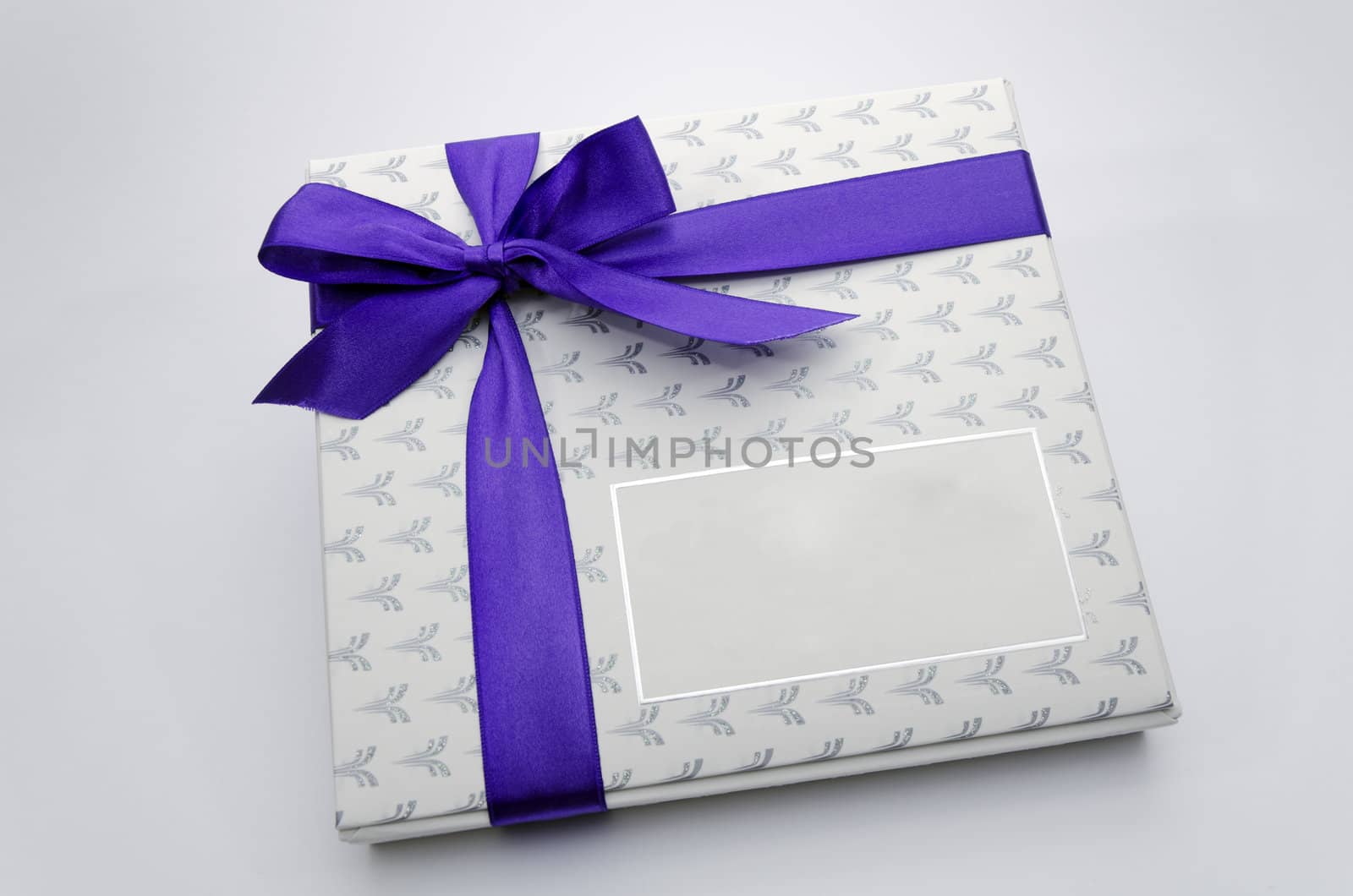 Printed over a purple ribbon gift box