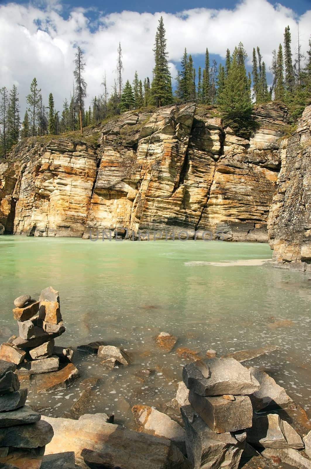 rocky shores of a mountain river in the Canadian Rockies