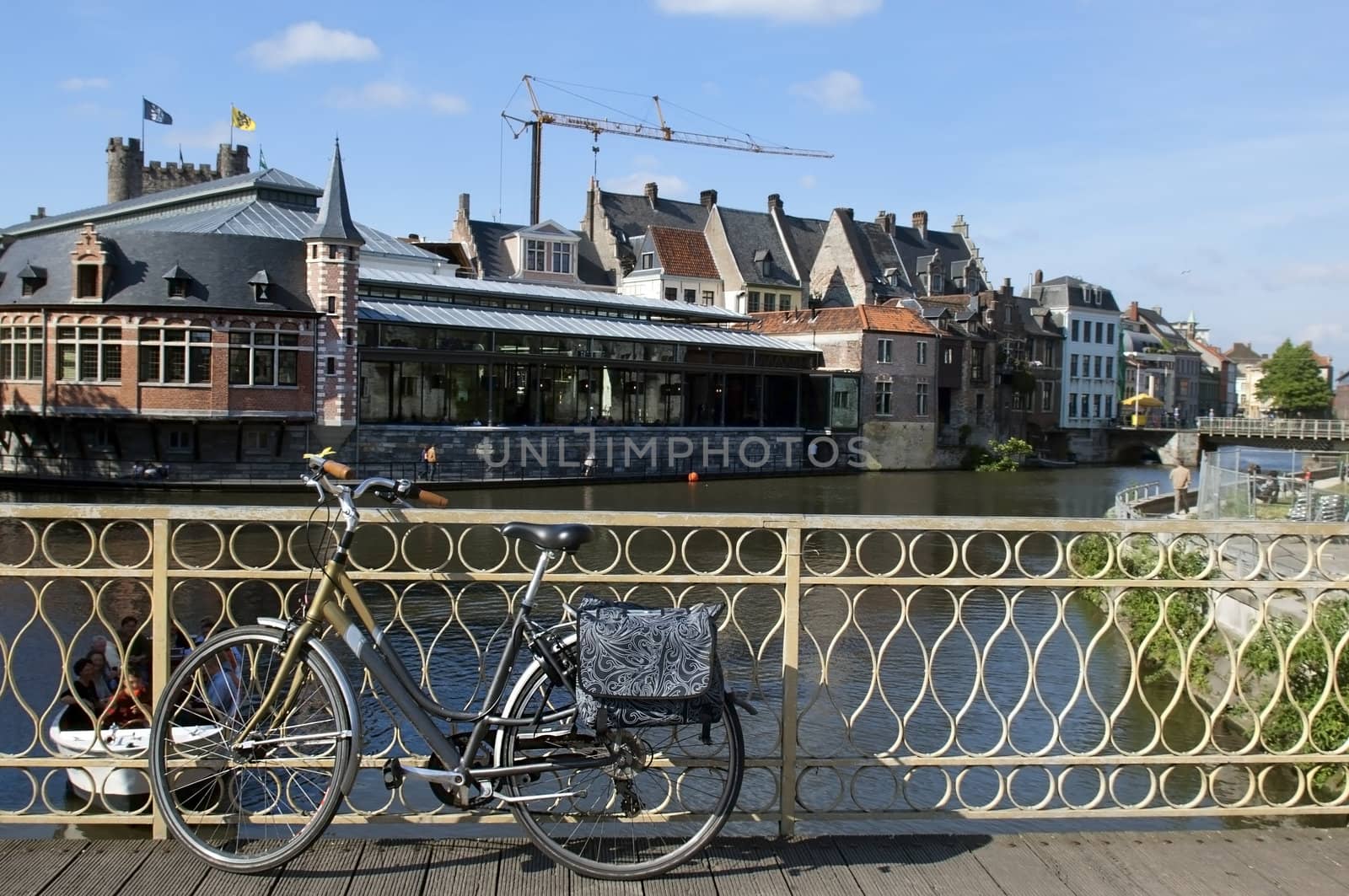 urban landscape in Belgium, view from the bridge, vintage bicycle in the foreground