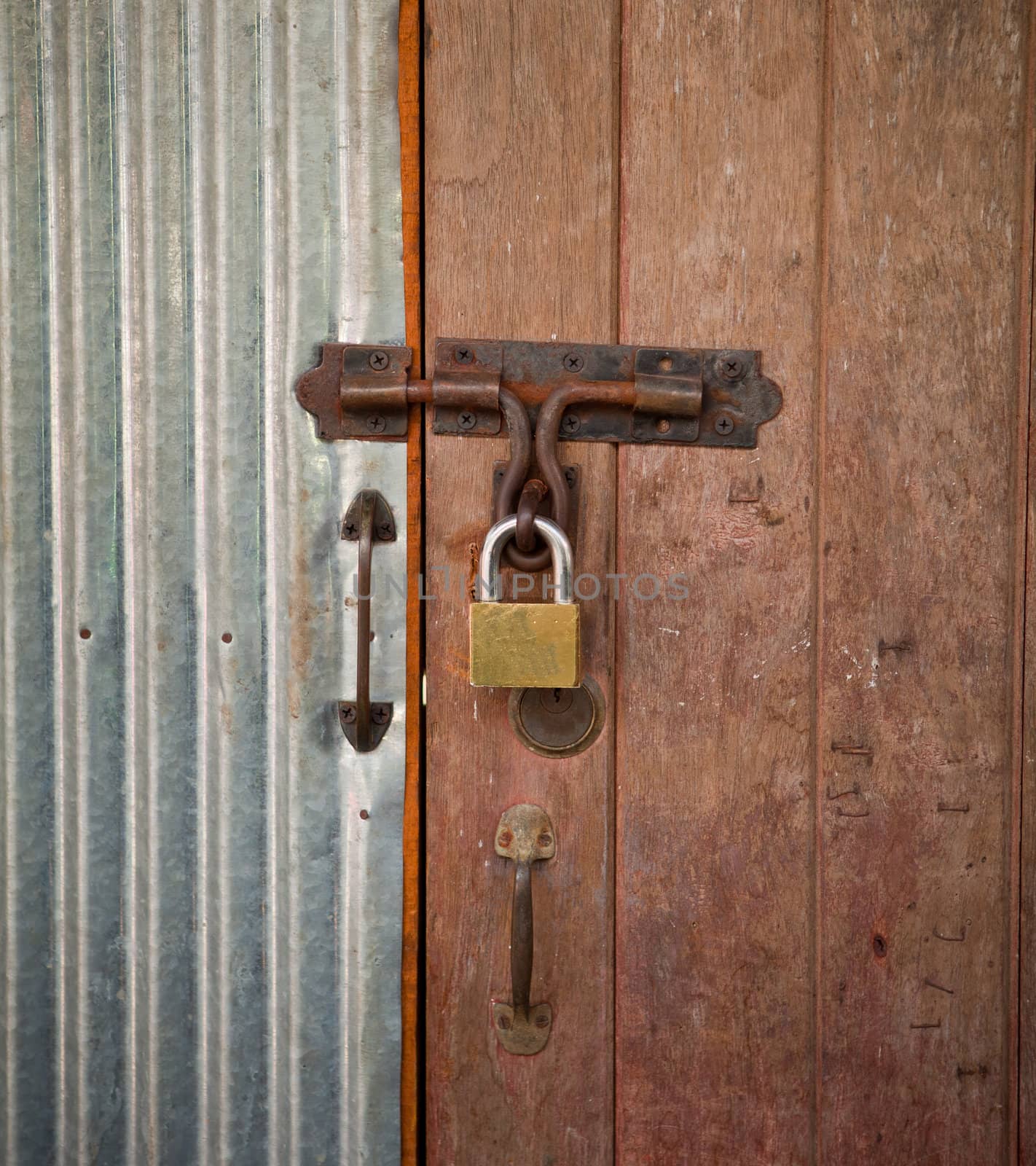 closeup old Wood house door rust lock