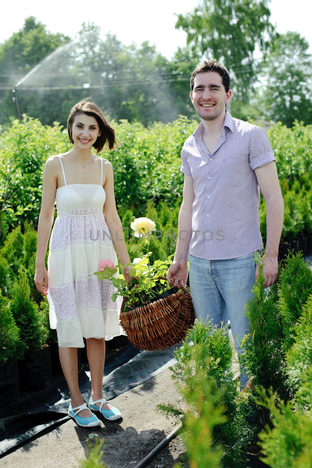 An image of a young couple with basket with roses