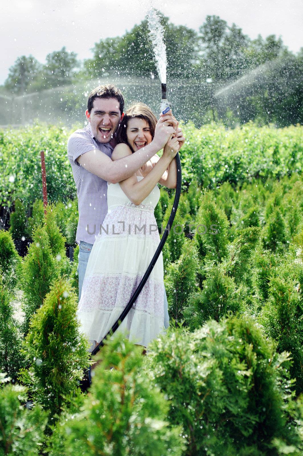 An image of a young couple playing in the garden