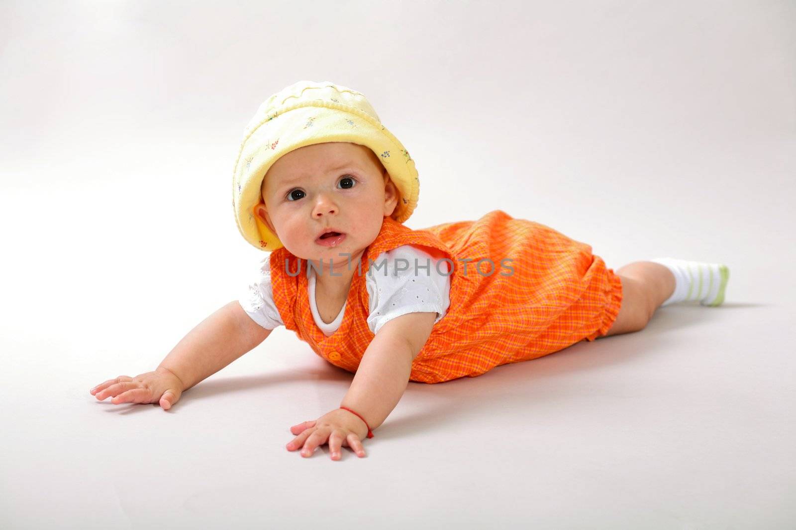 A nice baby-girl crawling on the floor