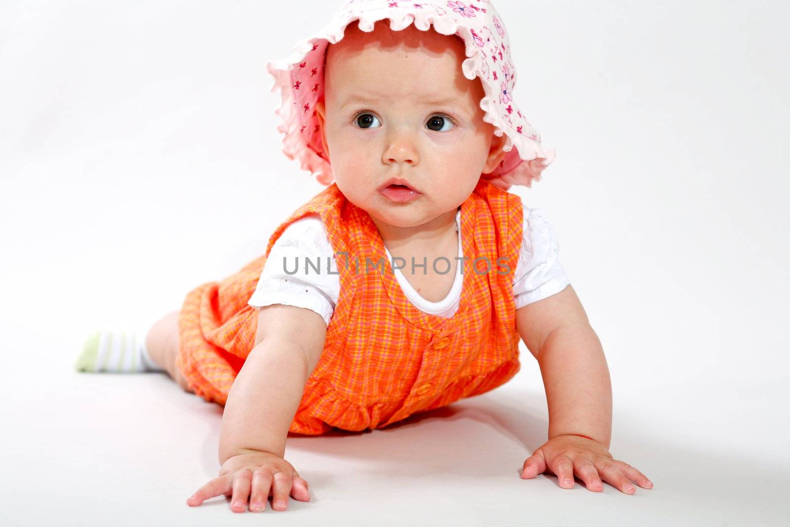 A little baby-girl crawling on the floor
