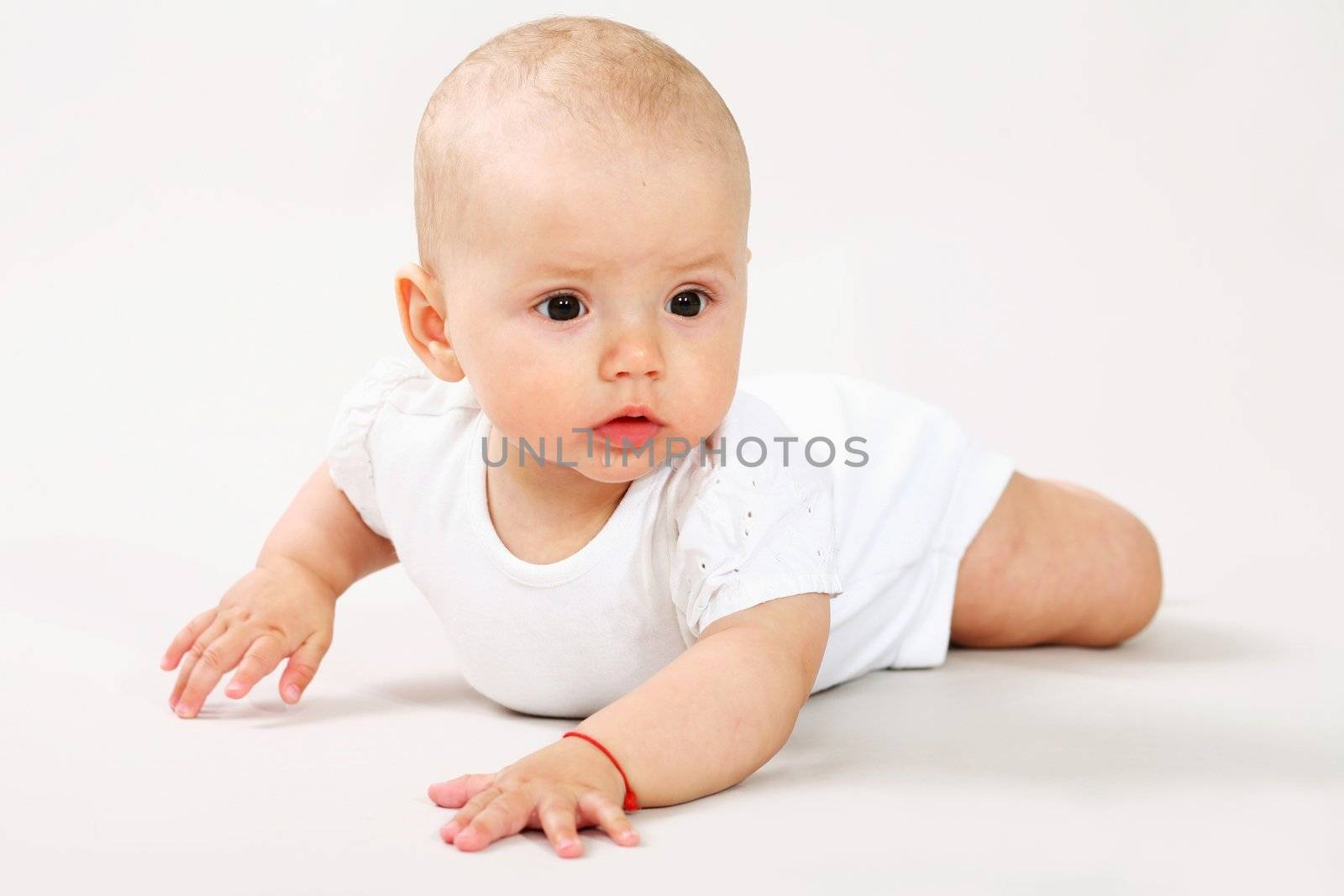 A little baby crawling on the floor