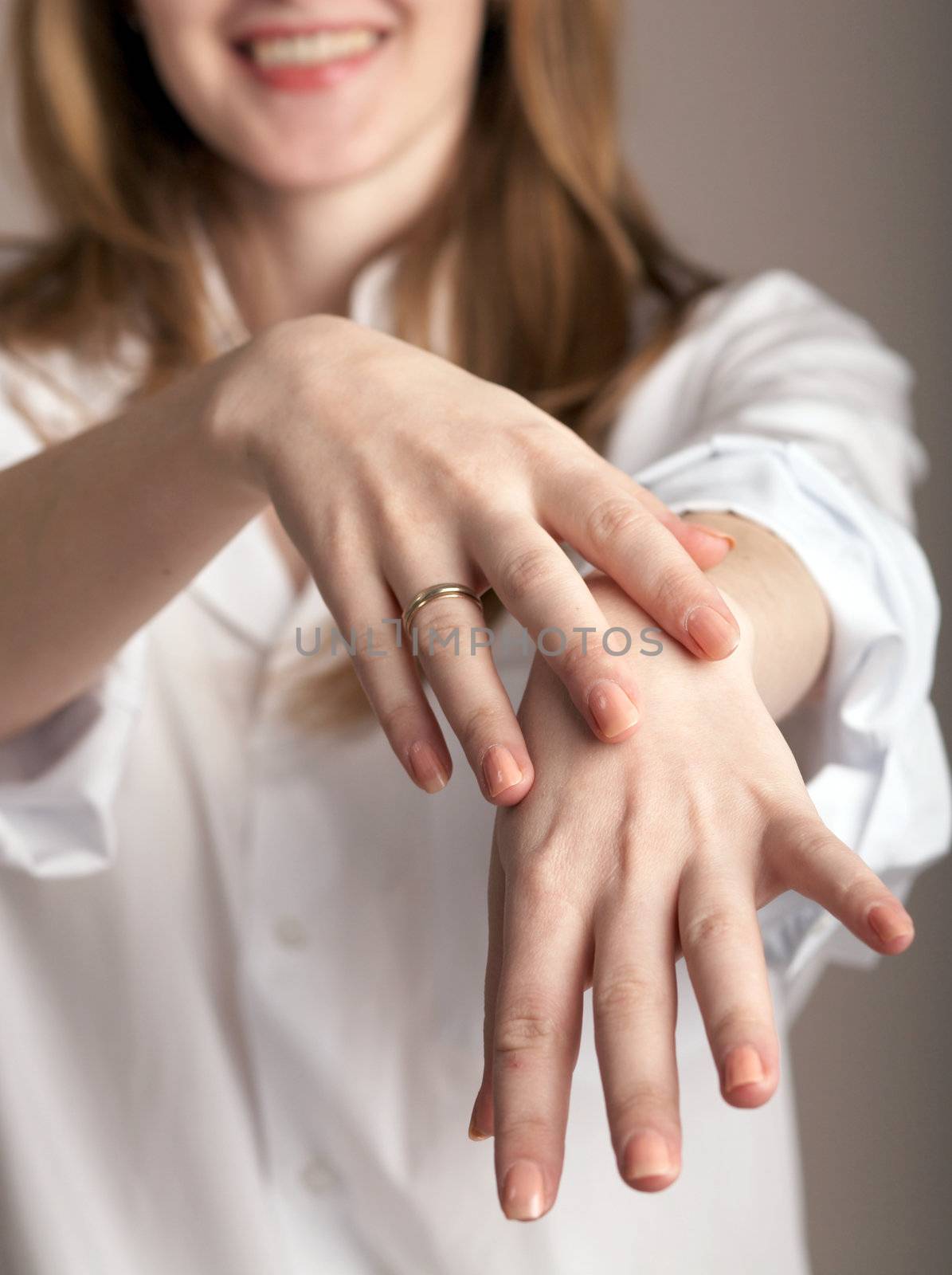 A woman in white shirt showing her hands