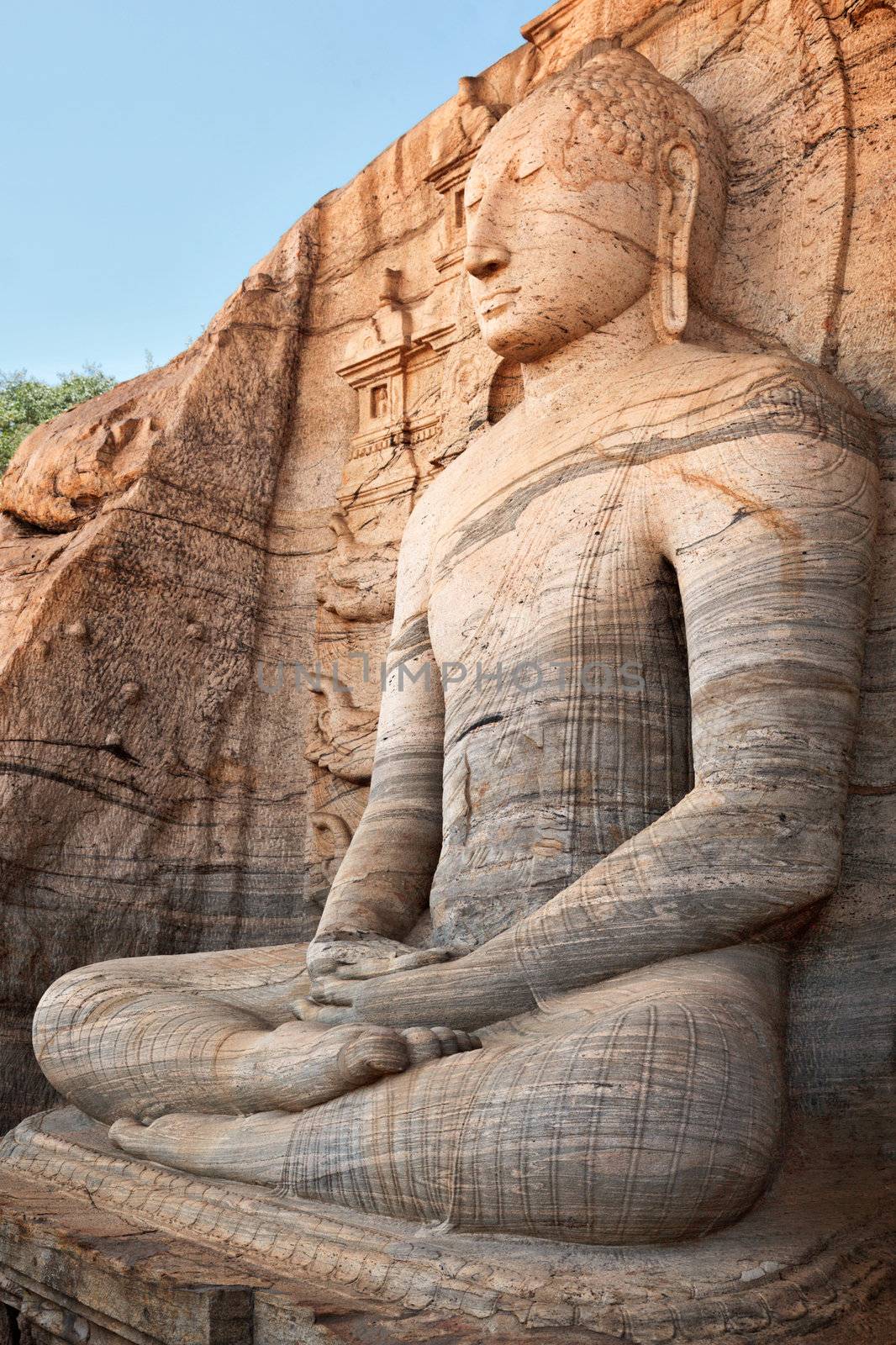 Ancient sitting Buddha image by dimol