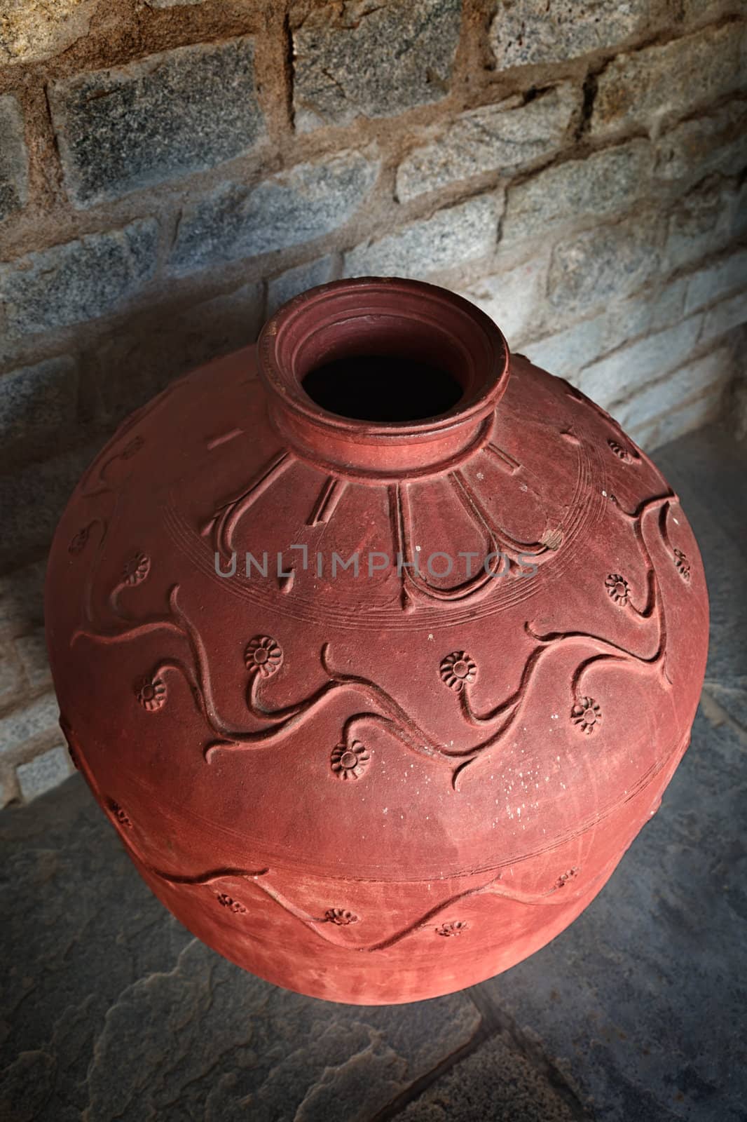 Indian traditional clay jar on floor