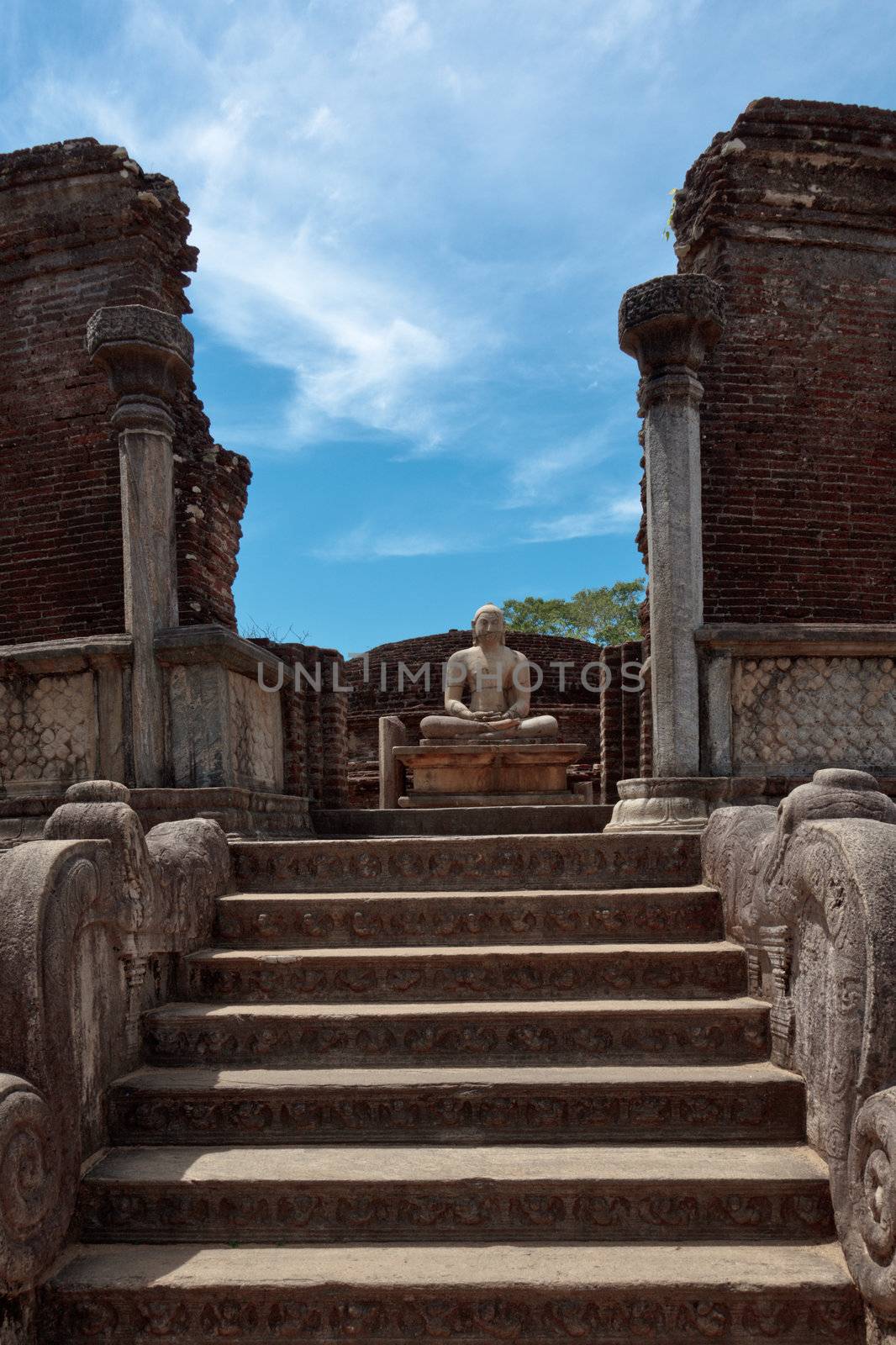 Ancient sitting Buddha image in votadage. Pollonaruwa, Sri Lanka