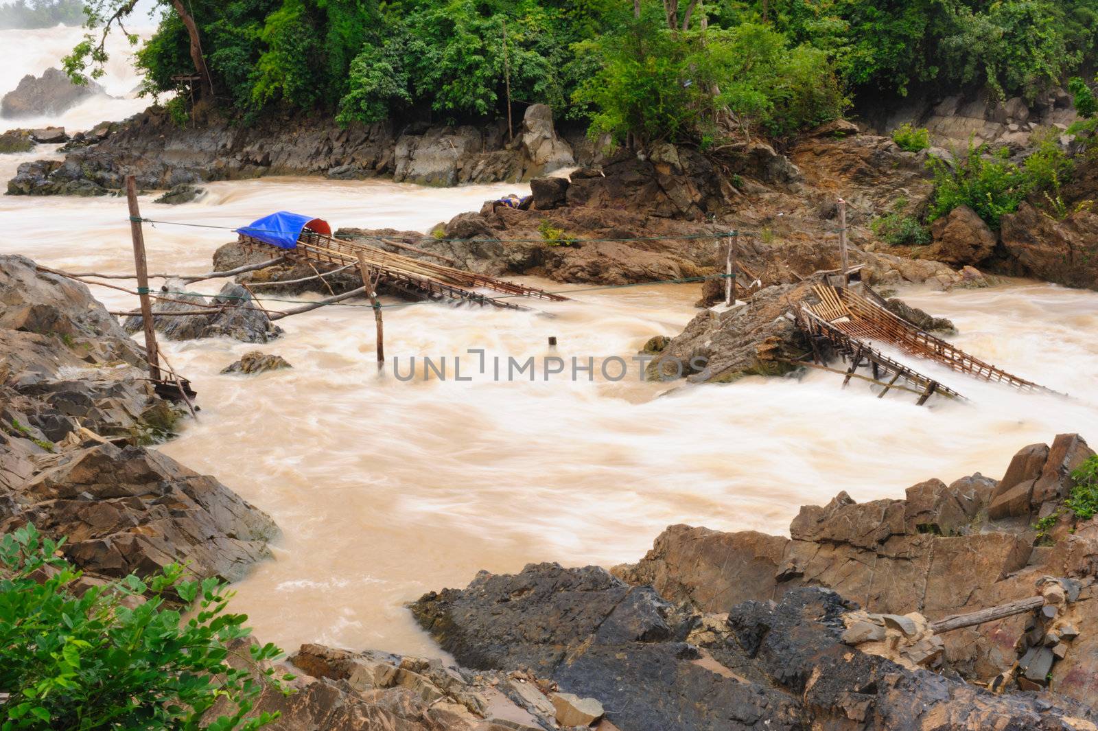 Fishing equipment in Con Pa Peng waterfall, Laos.  by ngungfoto