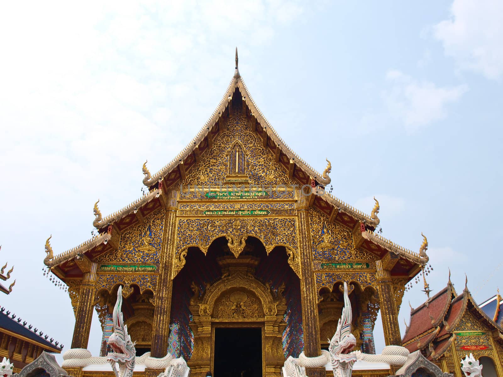 A golden buddhist monastery in Wat Baan Den in Chiang Mai, Thailand built by Northern Thai architectural style