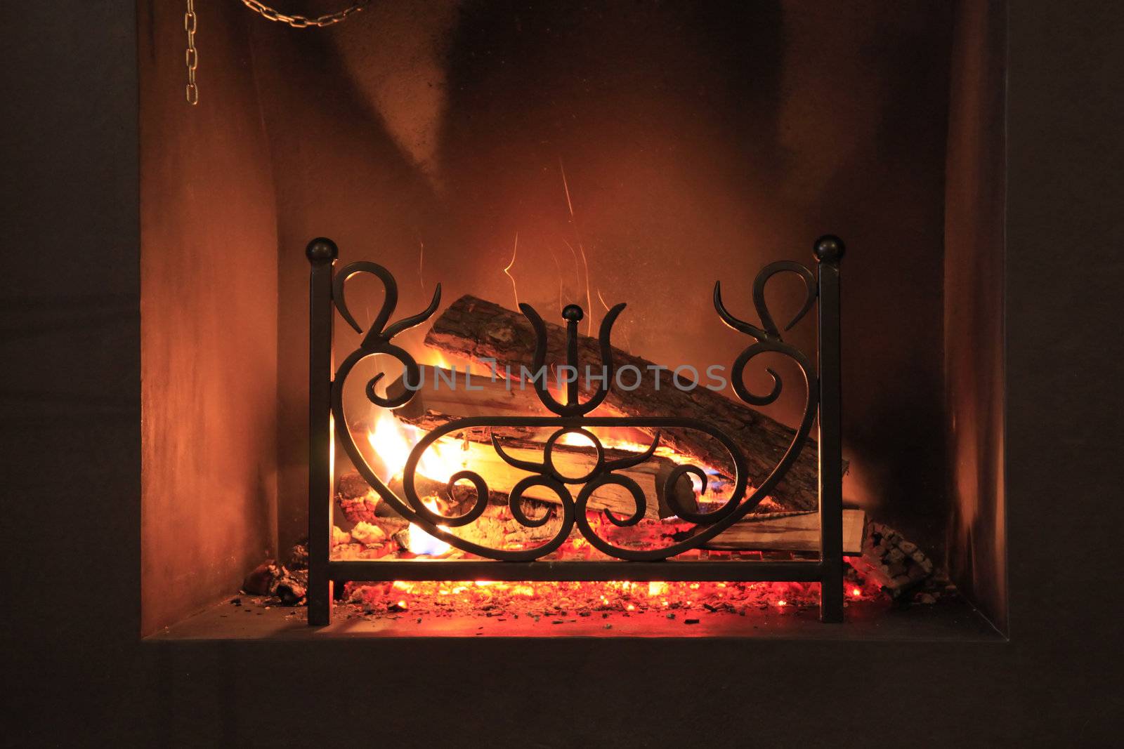 Fire with sparks in a beautiful fireplace