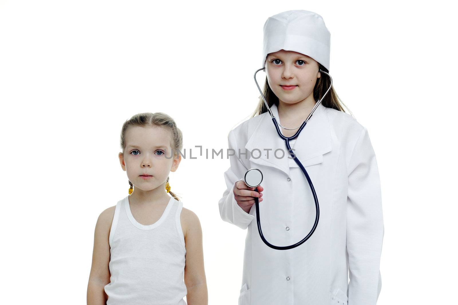 An image of two little girls playing doctors