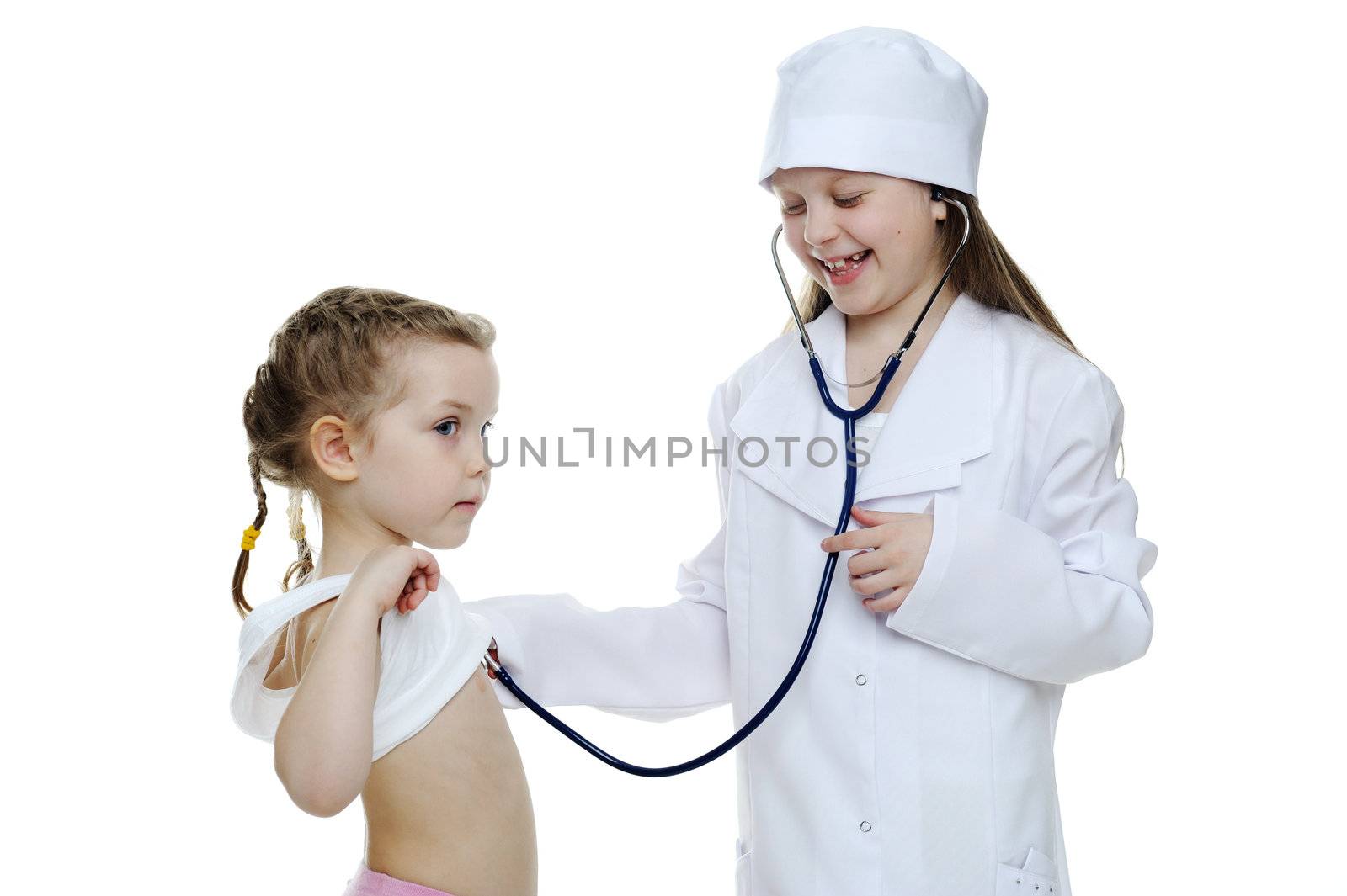 An image of two little girls playing doctors