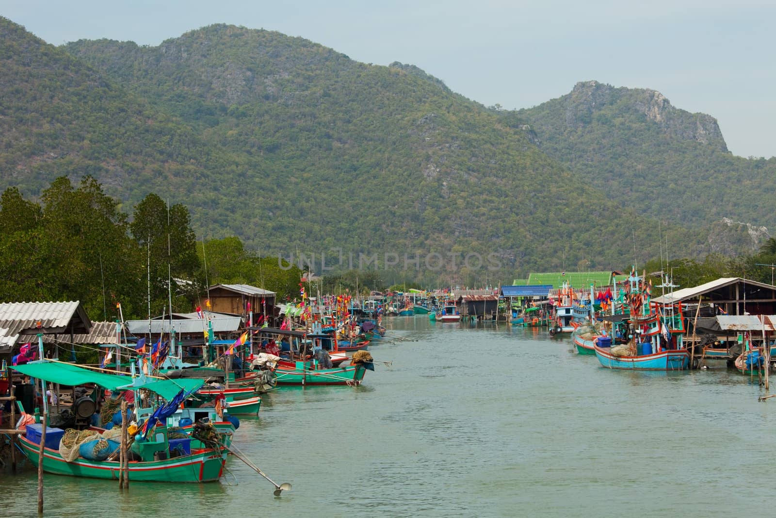 scene of fishing boats at a port in Thailand