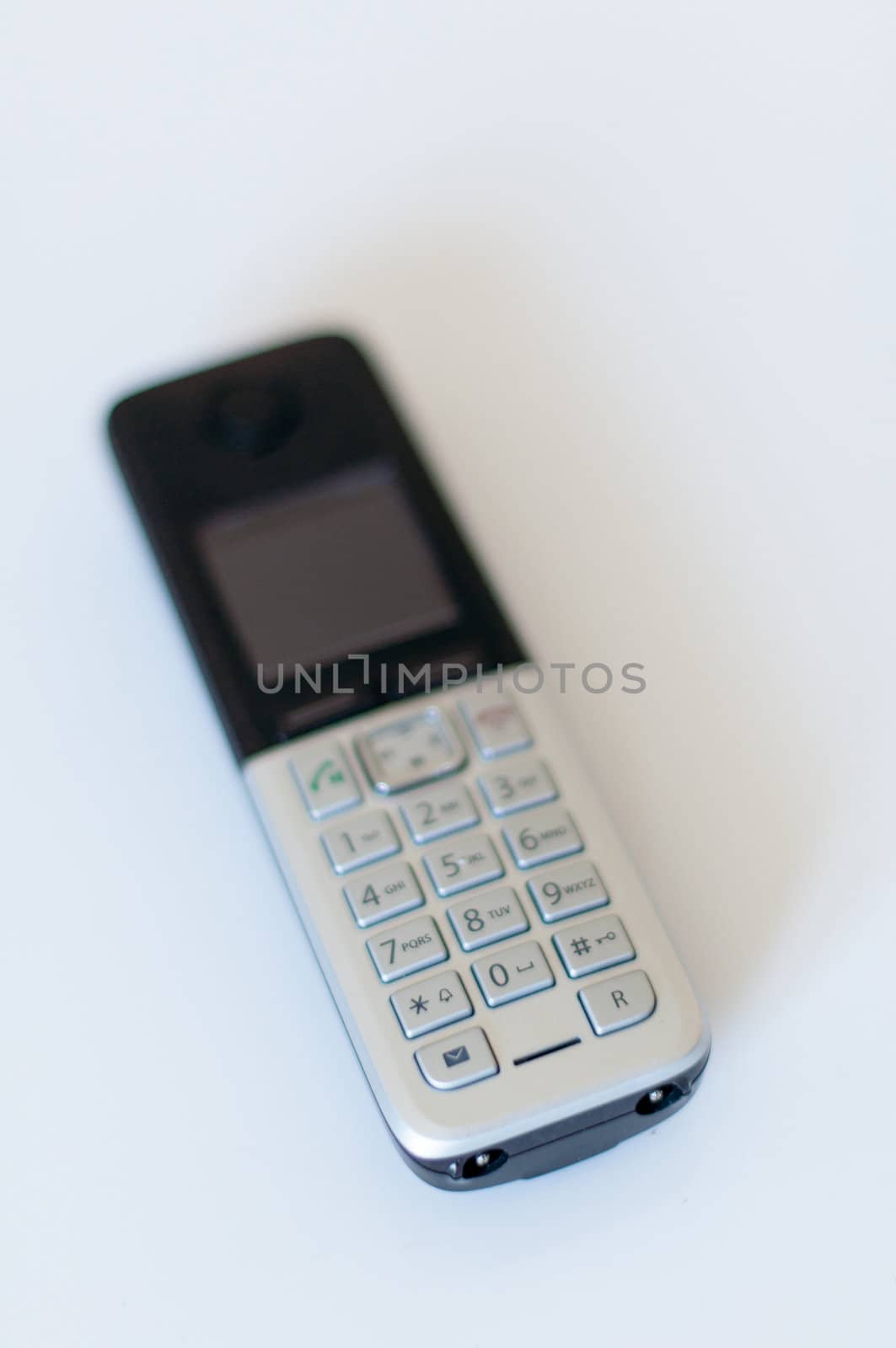 Close Up of Modern Cordless Black and Silver DECT Phone on White Background