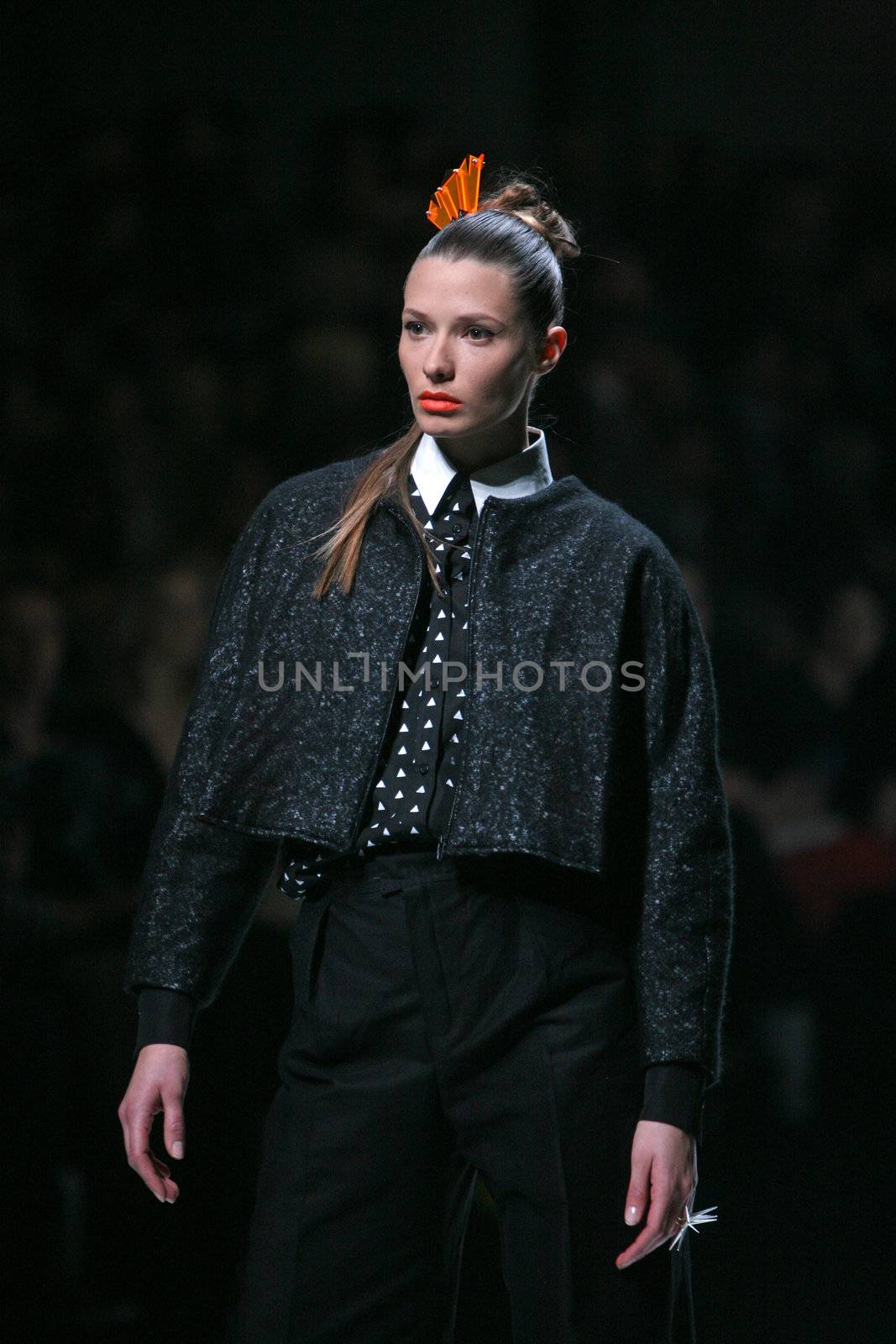 ZAGREB, CROATIA - MARCH 15: Fashion model wears clothes made by design group "Clash of 9" on "Dove FASHION.HR" show on March 15, 2012 in Zagreb, Croatia.