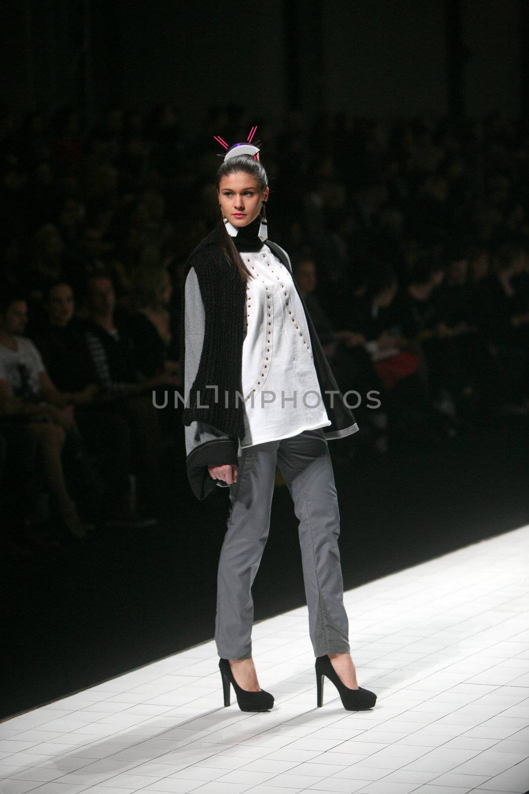ZAGREB, CROATIA - MARCH 15: Fashion model wears clothes made by design group "Clash of 9" on "Dove FASHION.HR" show on March 15, 2012 in Zagreb, Croatia.