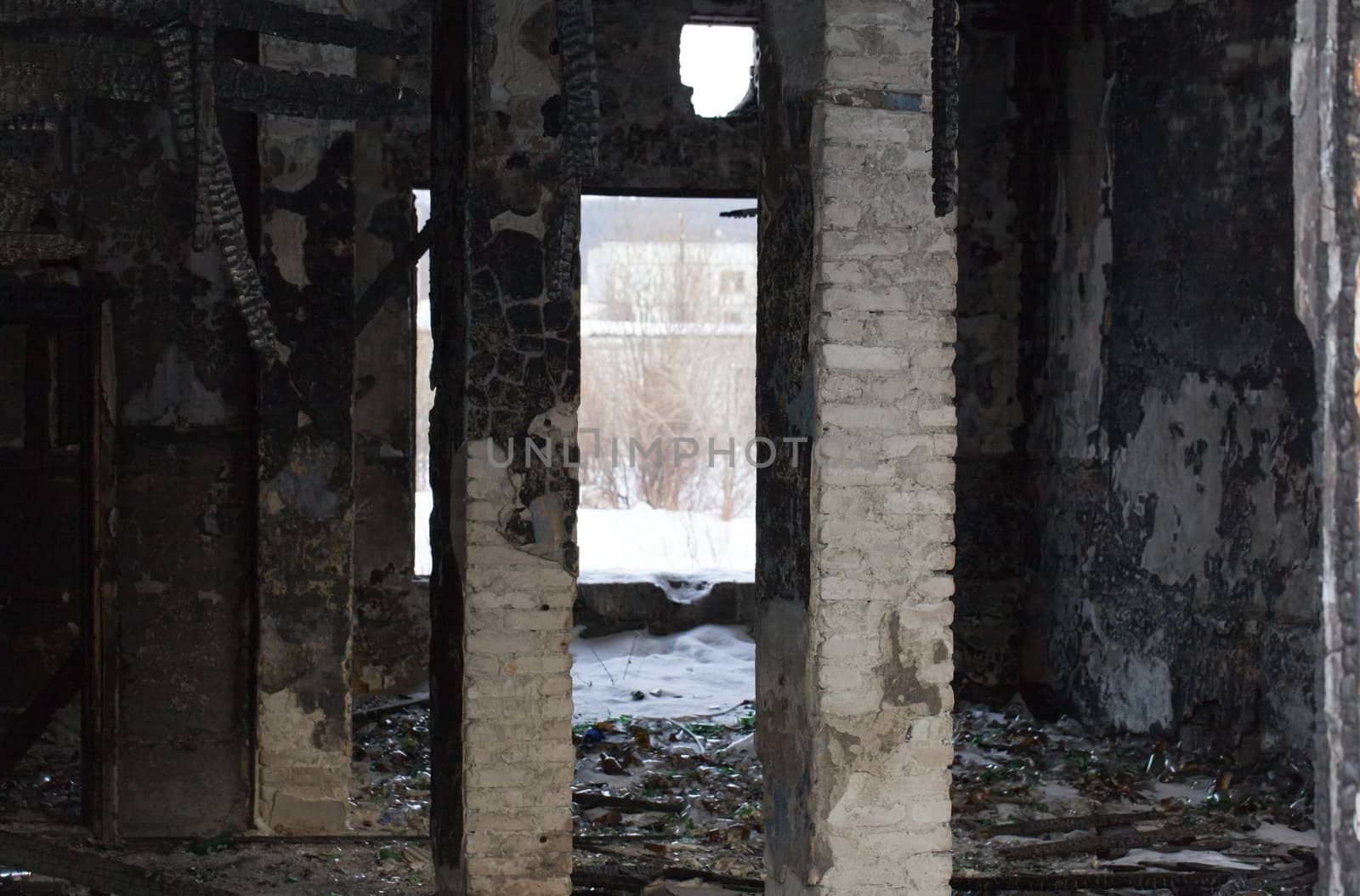 The charred ruins and remains of a burned down house