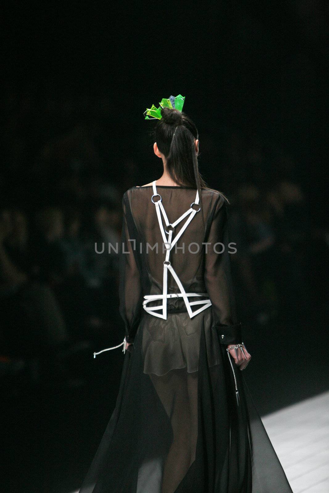 ZAGREB, CROATIA - MARCH 15: Fashion model wears clothes made by design group "Clash of 9" on "Dove FASHION.HR" show on March 15, 2012 in Zagreb, Croatia.