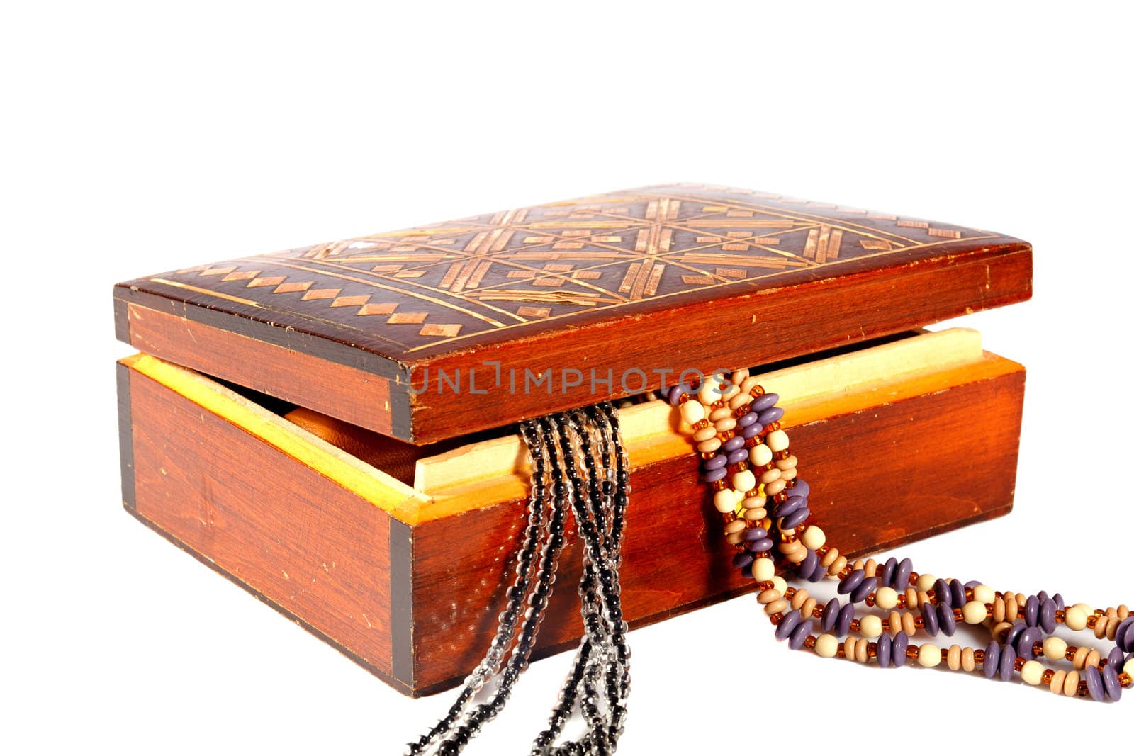 old brown wooden jewelry box on a white background