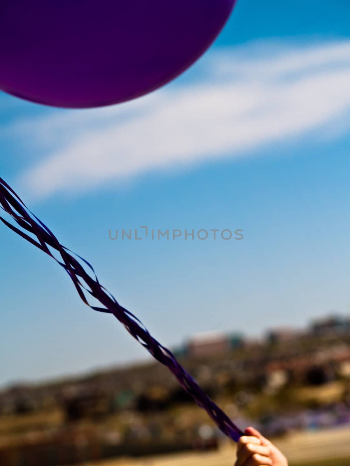Pretty little girl with baloons in hand by chaosmediamgt
