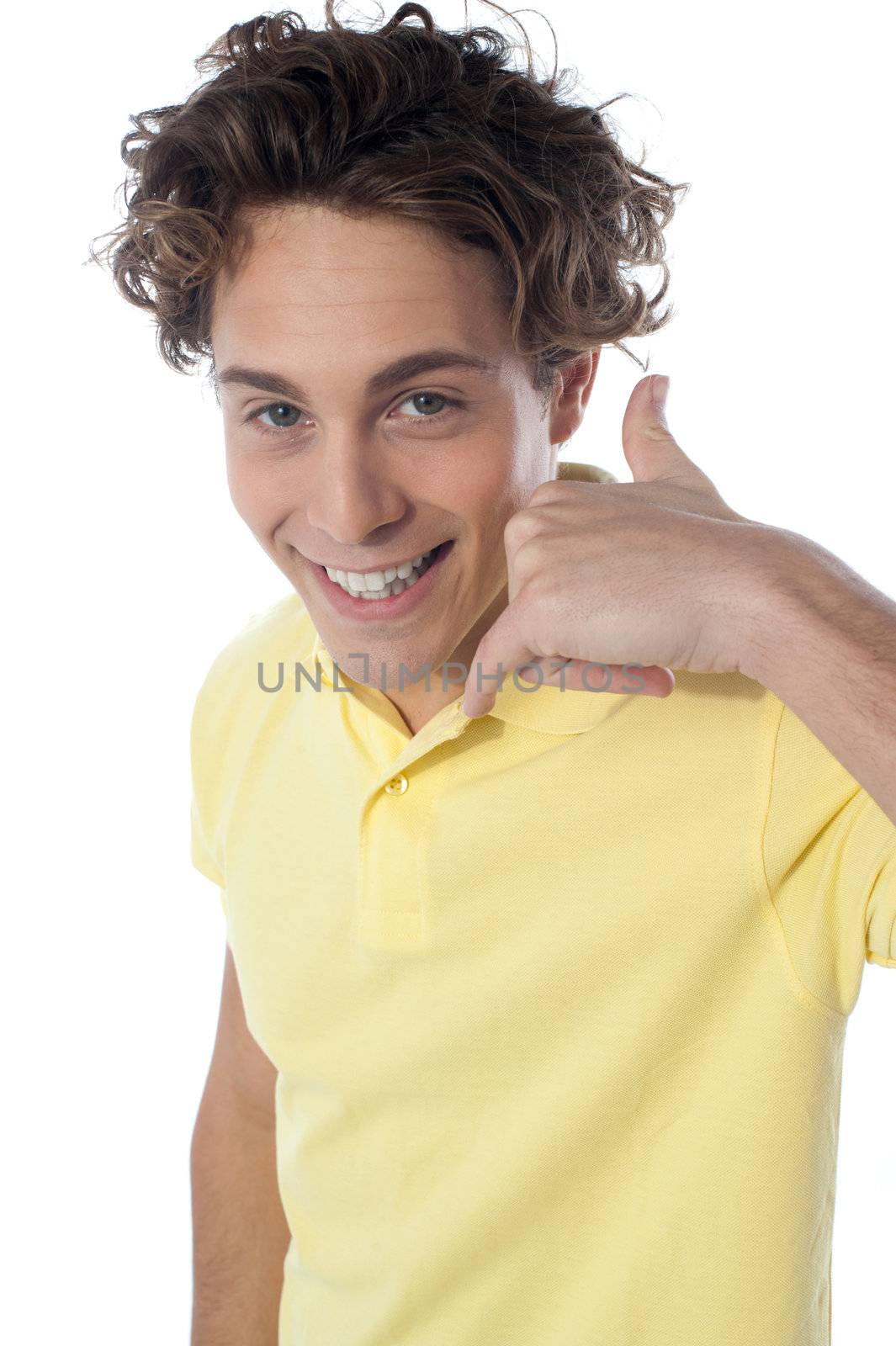 Handsome young guy gesturing call sign in front of camera