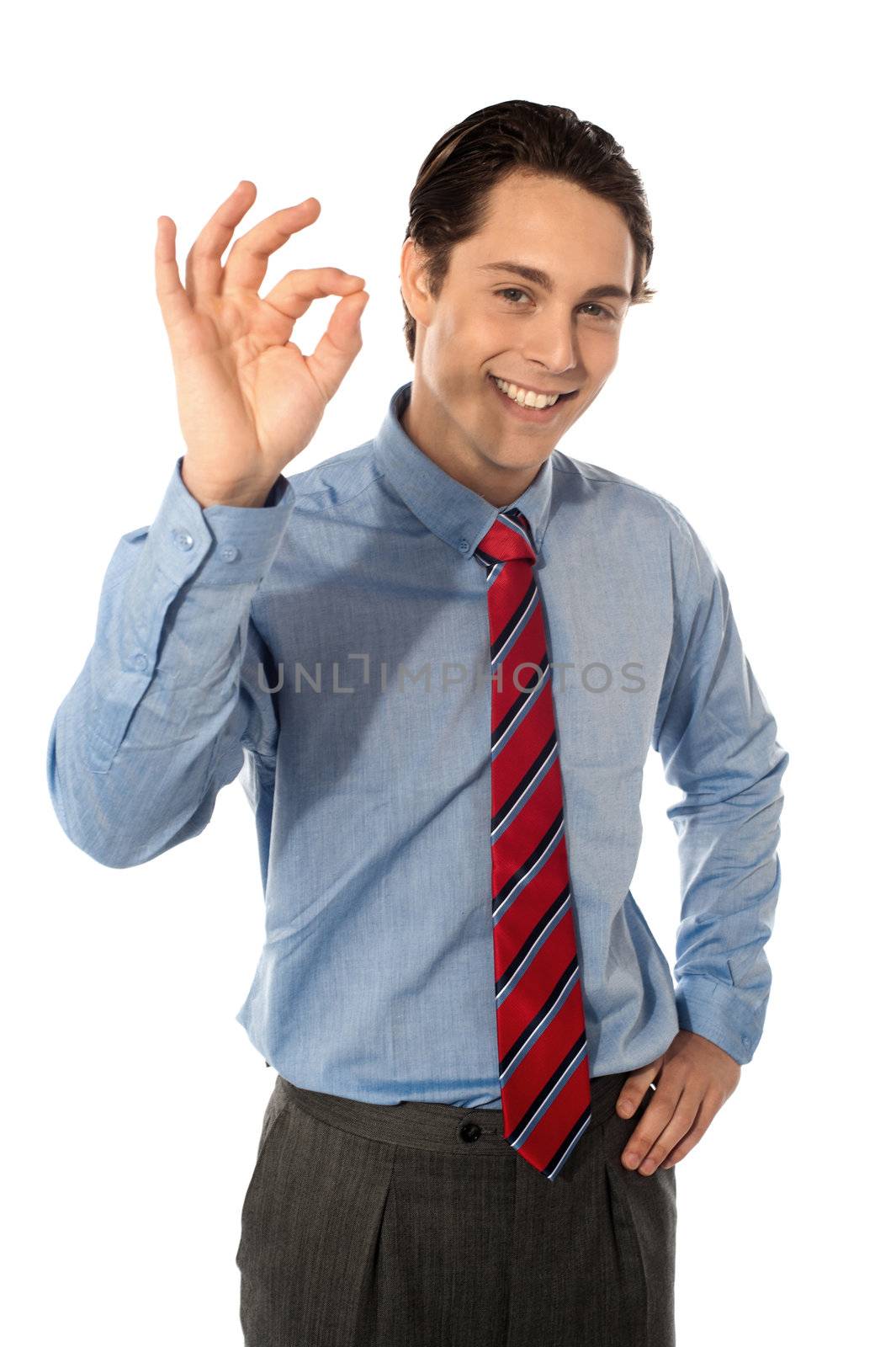 Male executive gesturing great ok sign by stockyimages